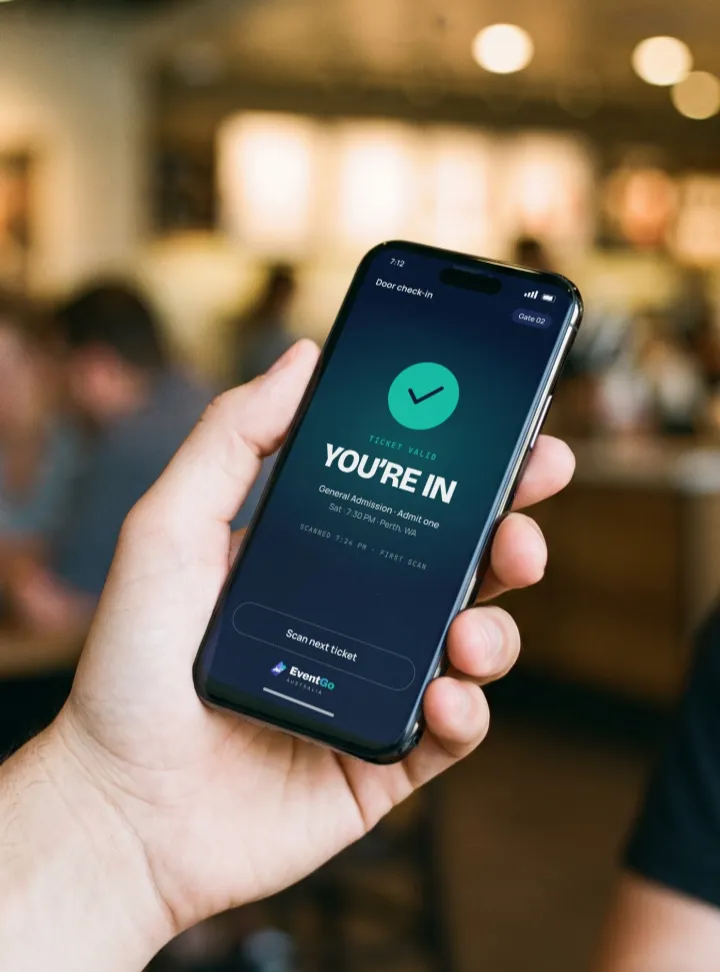 A phone at the door showing a successful check-in